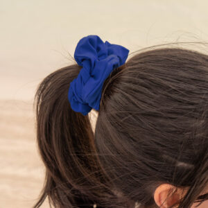 Model showcasing the scrunchies in navy