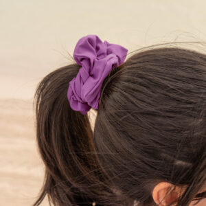 Model showcasing the scrunchies in purple