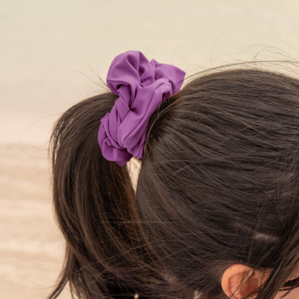 Model showcasing the scrunchies in purple