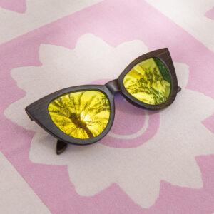 Mayoh's feline UV sunglasses with gold lenses made with black bamboo