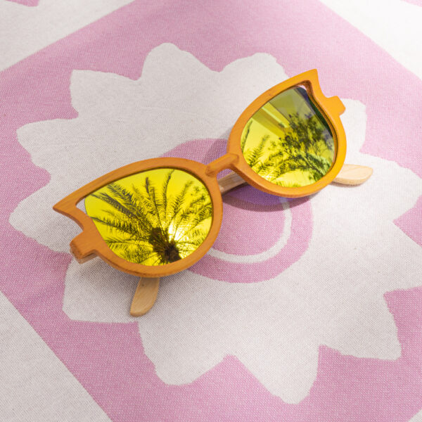 Mayoh's wing tipped gold UV sunglasses made with yellow bamboo